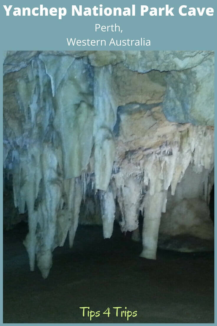 Looking into a low cave within Crystal Cave at Yanchep National park with staligtites hanging down