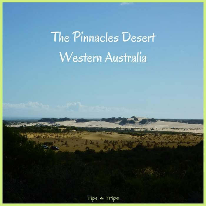The Pinnacles Desert with sand dunes in the distance