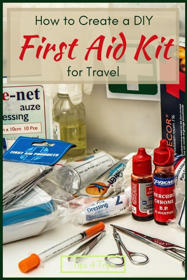 A selection of medical items from a first aid travel kit including antiseptic lotion, scissors, bandages and gauze