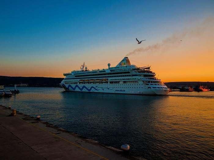 cruise ship in port at sunset