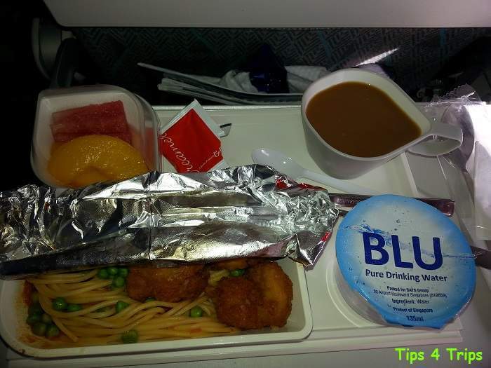 Meal on SilkAir with crumbed chicken pasta, fruit and coffee.
