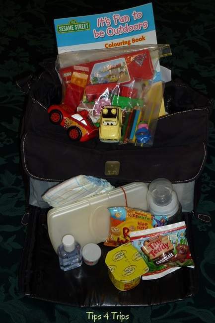 A selction of essential items for baby on a plane