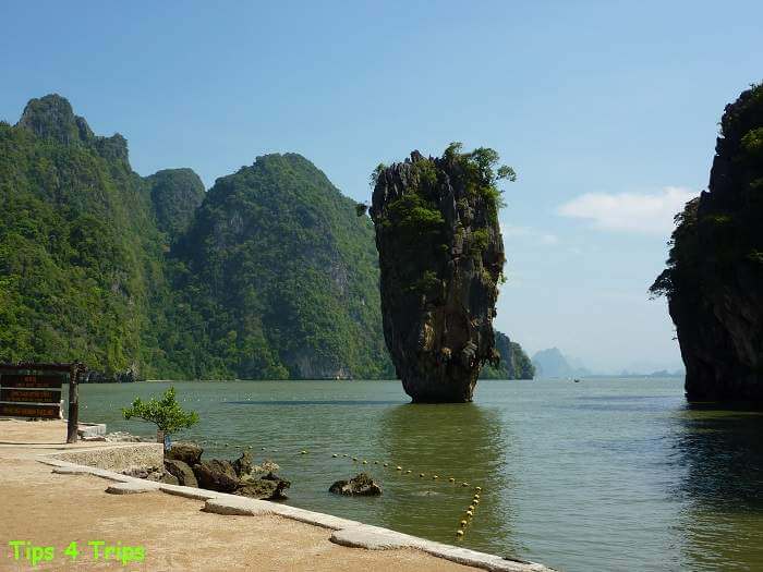 The tall and narrow limestone James Bond Island covered in vegetation