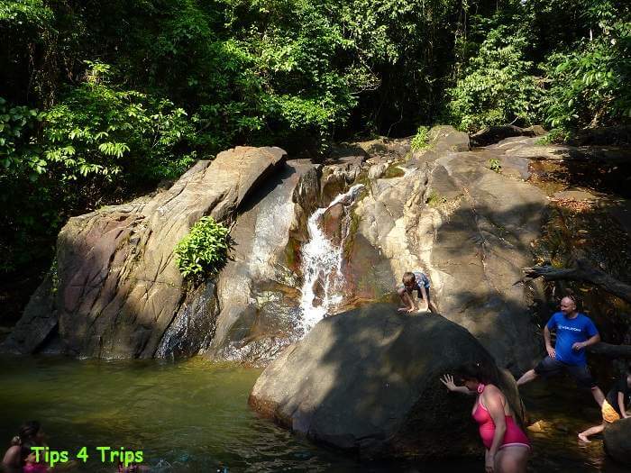 People swimmng in Ton Pling Waterfall, Thailand
