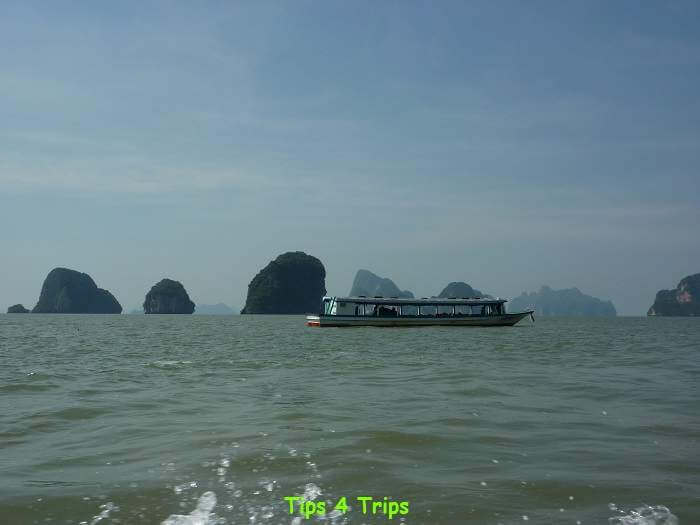 The limestone islands on the horizon in Phang Nga Bay