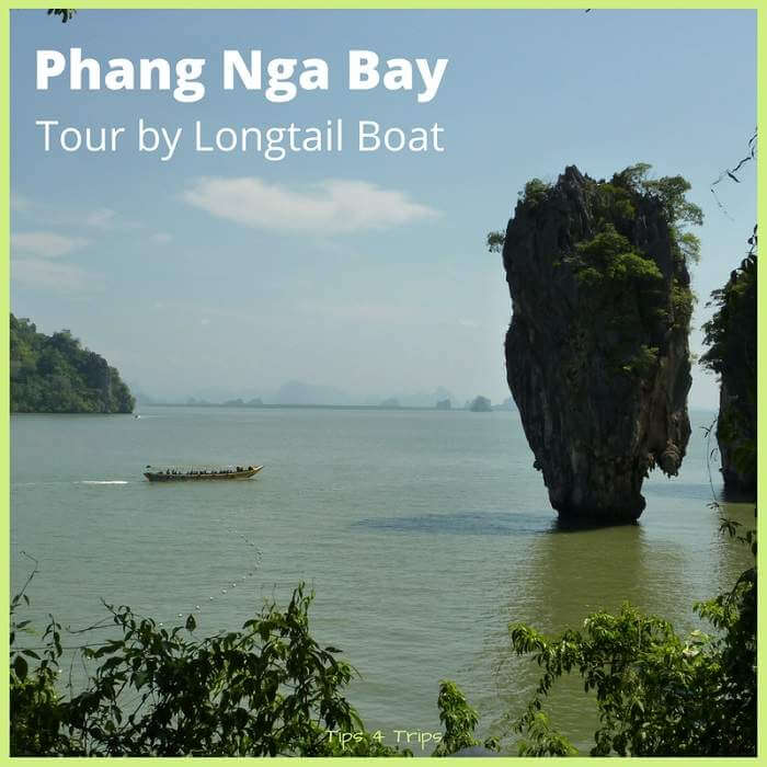 Text overlay "Phang Nga Bay tour by longtail boat' image of longtial boat cruisig passed james Bond island