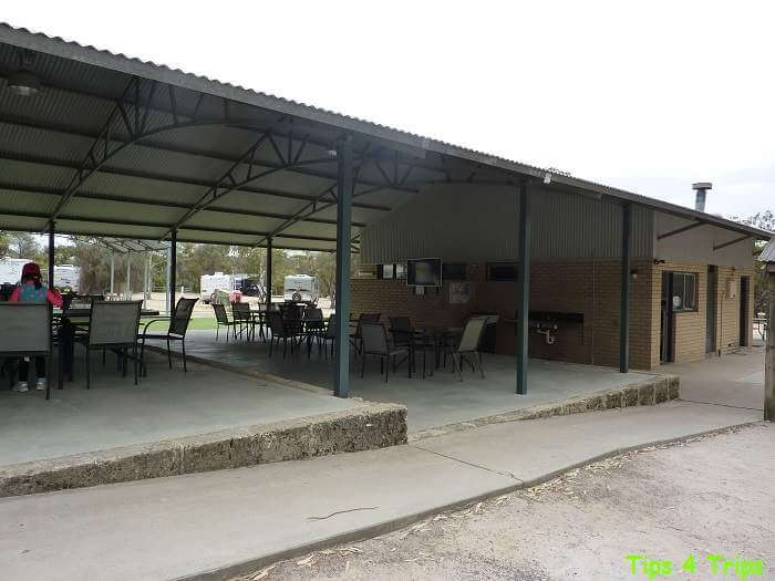 Large sheltered area with tables and chairs for campers to eat
