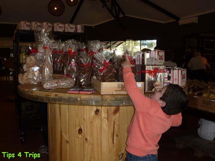 Boy reaching for chcolate Whistler Swan Valley chocolate factory