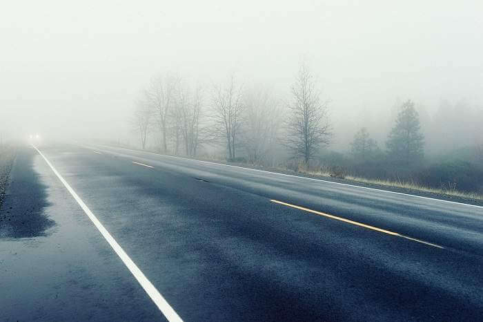 Assessing wet and foggy road on road trip checklist