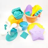 a set of beach toys including buckets and moulds