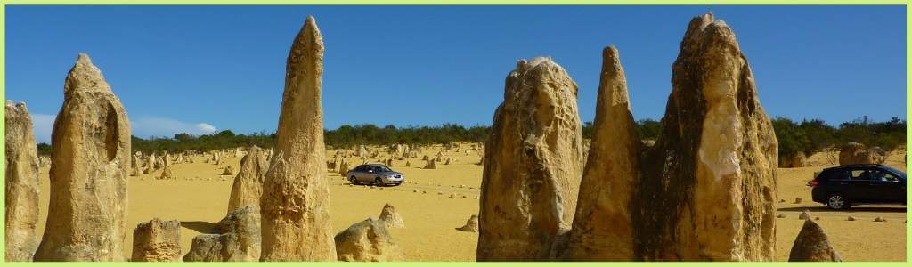 The Pinnacles Desert in Western Australia. Limestone rocks jutting out of barren yellow and