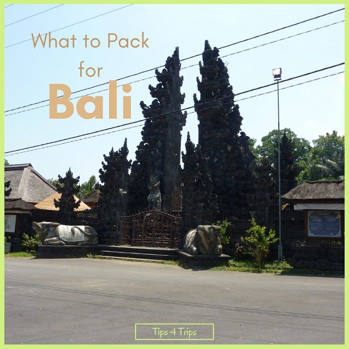 Outside Bali temple with ornate stone gates and bulls includes text overlay what to pack for bali