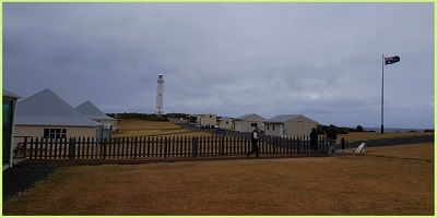 Looking across cottages and buildings towards the lighthouse