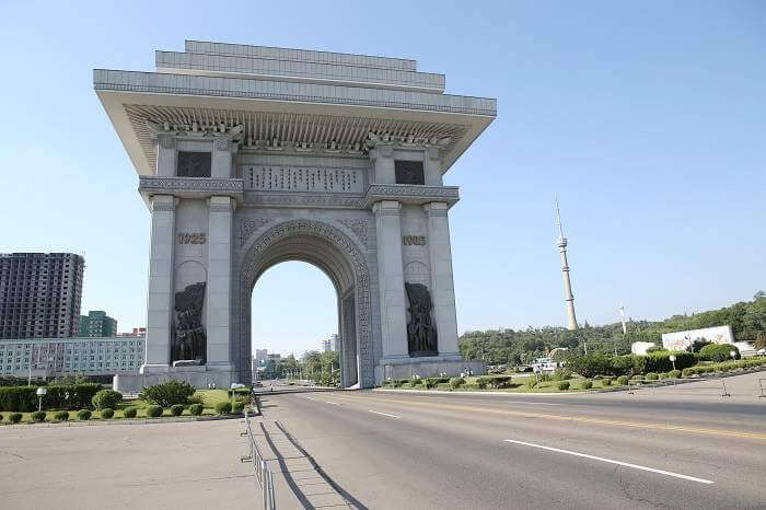 Very very large white arch of Triumph over road in North Korea
