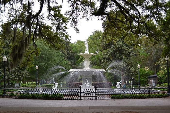 ornate white fountain in the middle of a Savannah, Georgia park