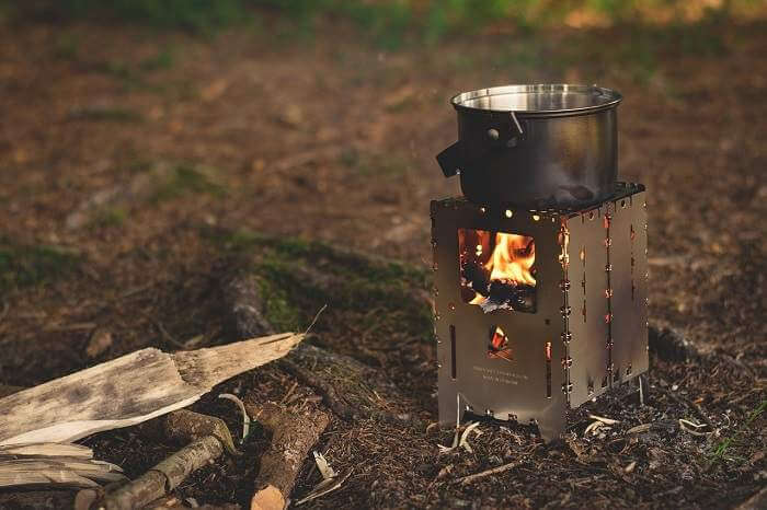 Folding metal box to make a wood fire to cook