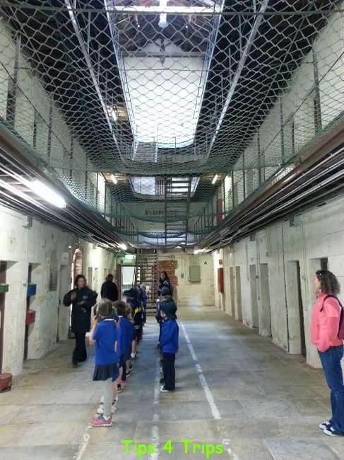 students lined up in front of Fremantle prison gaol cells