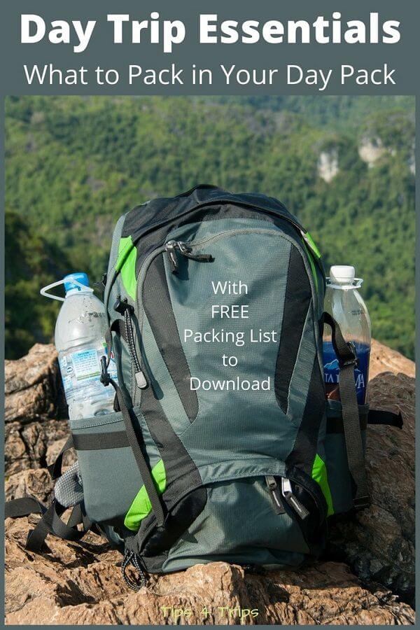 day pack sitting on the edge of a mountain cliff