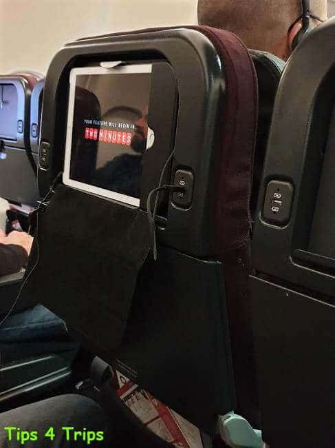 the inflight entertainment system iPad mounted on the seatback on a Qantas A330 in economy class