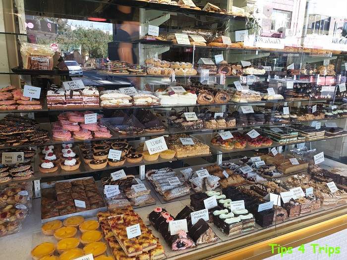 Cake display of a variety of pastries at bakery on Acland Street, St Kilda