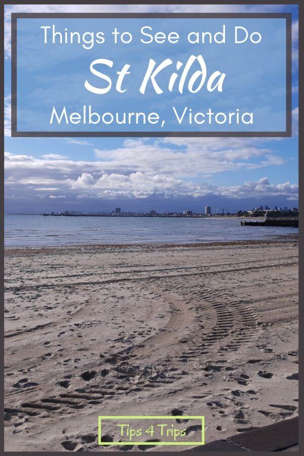 Looking across white sandy beach of St Kilda to the coastline of Port Phillip Bay