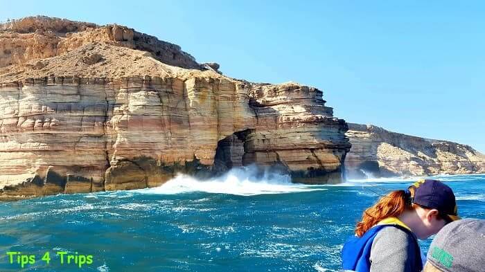 waves crashing against the striated sandstone Kalbarri Coastal Cliffs