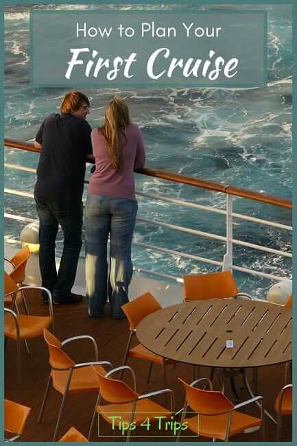 man and women standing on deck of cruise ship