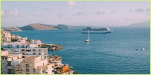 cruise ship anchored off an island