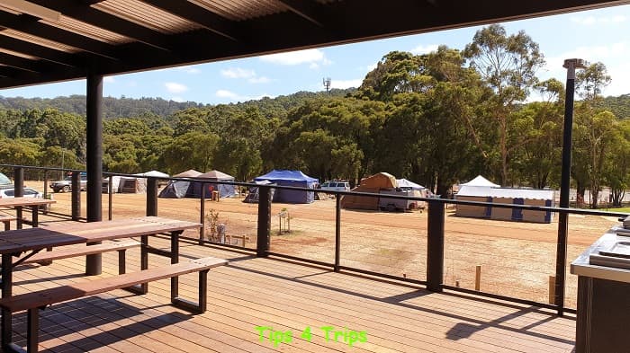 view from the Karri Valley Resort caravan park camp kitchen outdoor area looking at tents